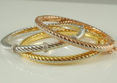 White, rose, and yellow gold plated stainless steel bracelets with diamonds