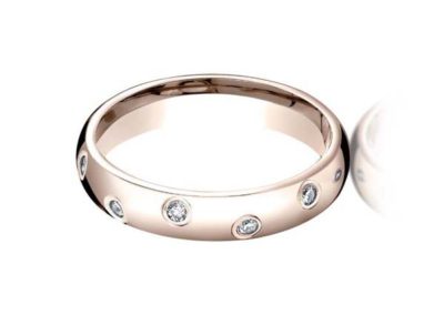 Rose gold wedding band with flush mounted diamonds