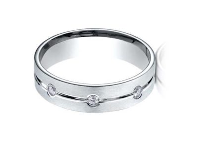 White gold wedding band with flush mounted diamonds, carved, matte finish