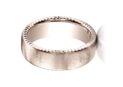 Rose gold wedding band with carved edge