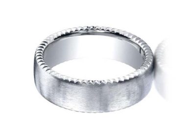 White gold wedding band with carved edge