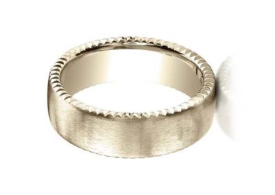 Gold wedding band with carved edge