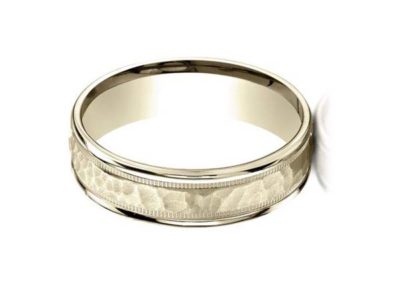 Gold carved wedding band with hammered finish