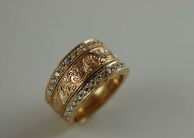18 kt yellow gold hand carved ring with diamond