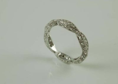 Women's white gold wedding band with diamonds, scalloped