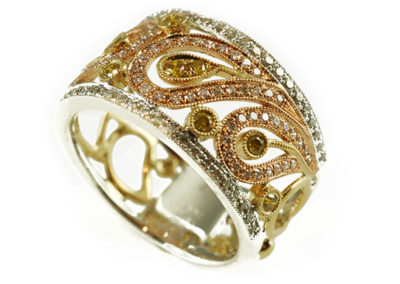 18 kt white, yellow, and rose gold ring with natural colored diamonds