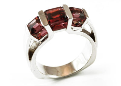 Custom designed 14 kt white gold ring with rhodolite garnets