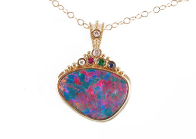 18 kt and 22 kt yellow gold necklace with boulder opal, diamonds, ruby, emerald, and sapphire