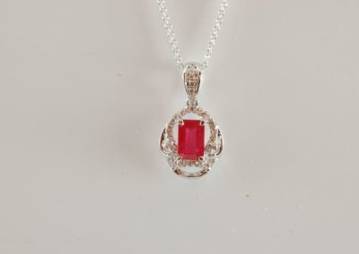 14 kt white gold ruby and diamond pendant