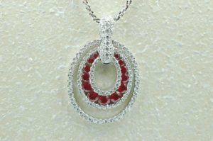 18 kt white gold ruby and diamond pendant