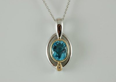 blue topaz pendant in 18kt yellow gold and sterling silver