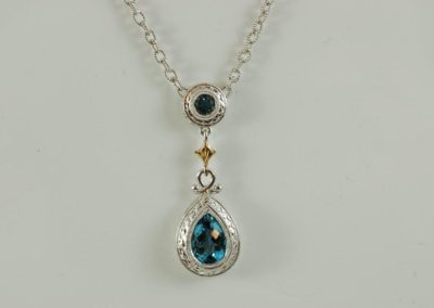 blue topaz pendant in sterling silver & 18kt yellow gold