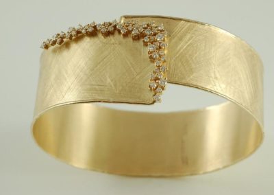 custom 14 kt gold and diamond bangle bracelet