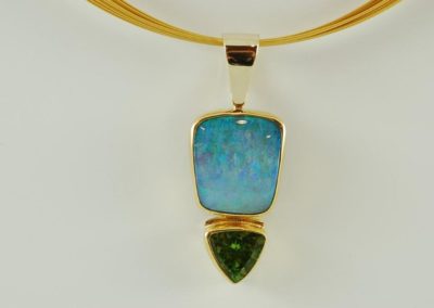 custom 18 kt and 22 kt gold boulder opal and peridot pendant
