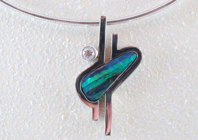 opal pendant with diamond in 14 kt white gold