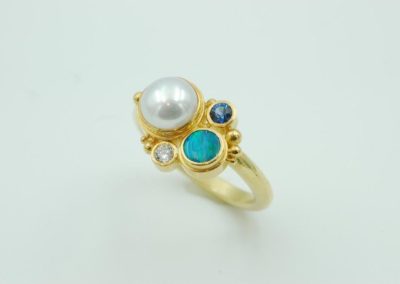opal ring with pearl, diamond, and sapphire