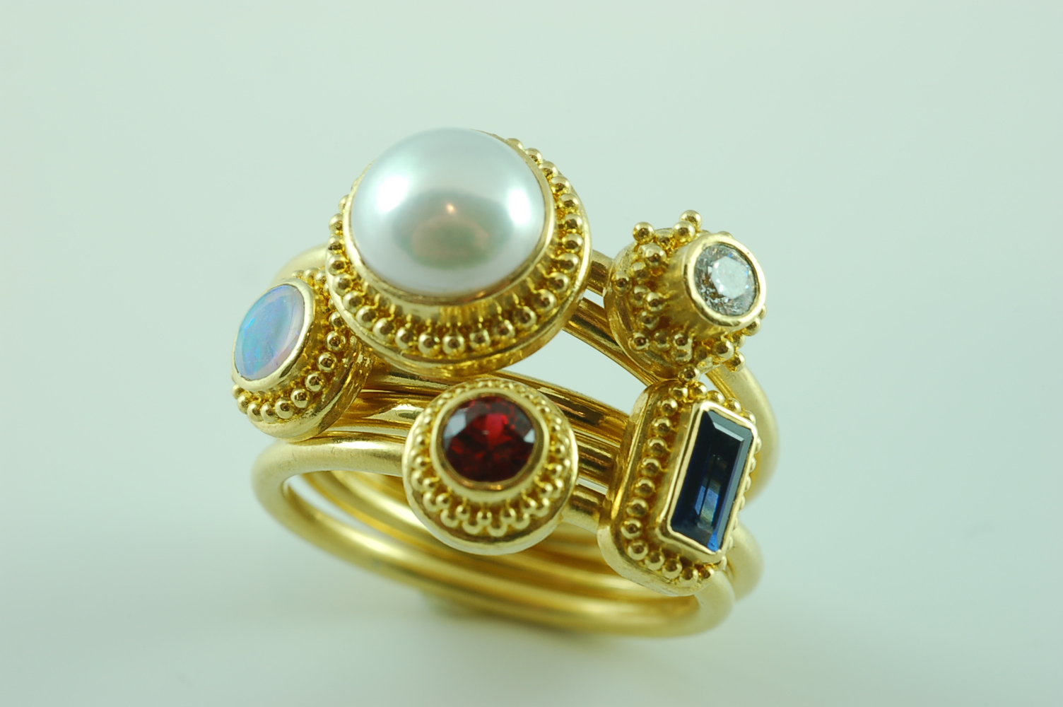 a mothers ring with various stones